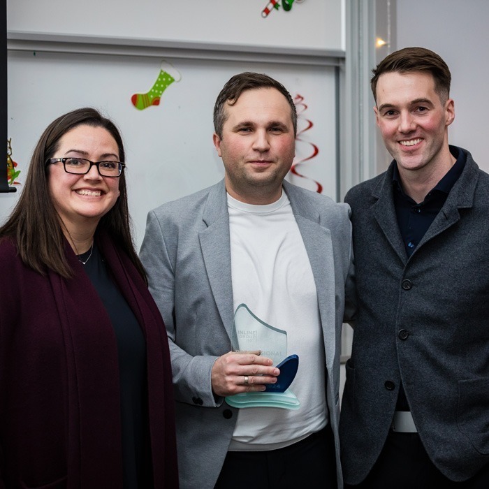 Inline Group staff member receiving an award
