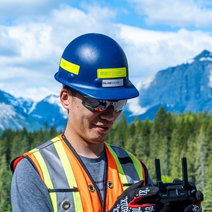 Inline Group staff member operating a drone