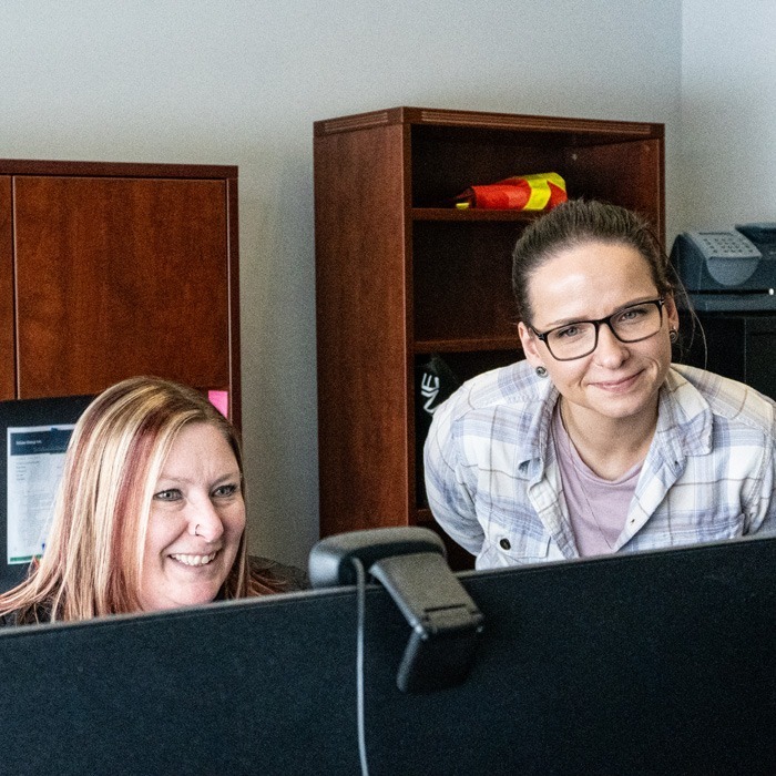 Inline Group staff working at the computer