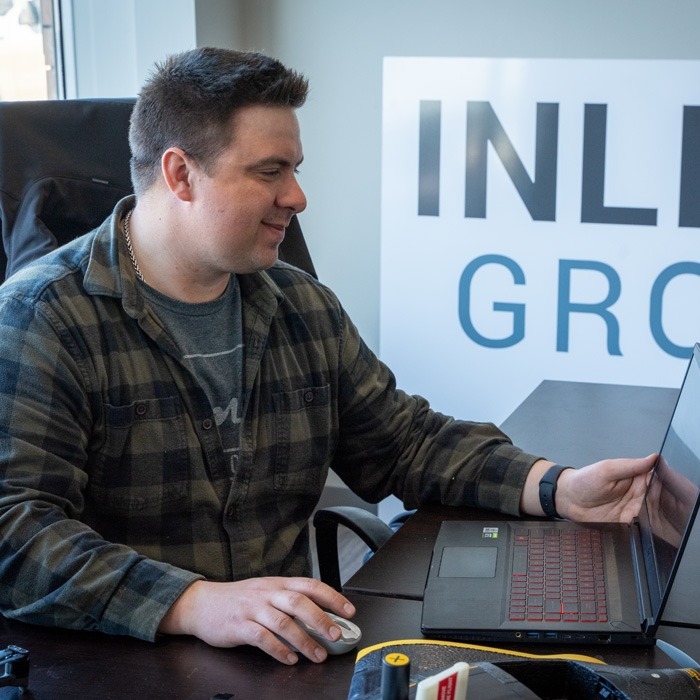 Inline Group staff member working at the computer