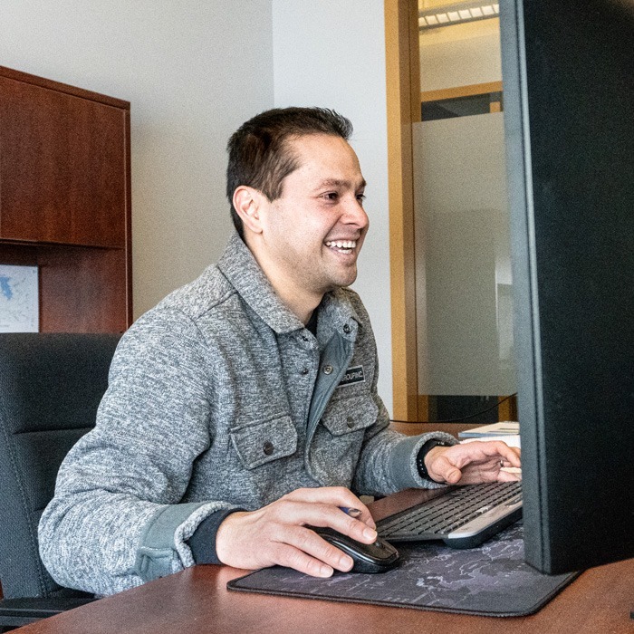 Inline Group staff member working at the computer